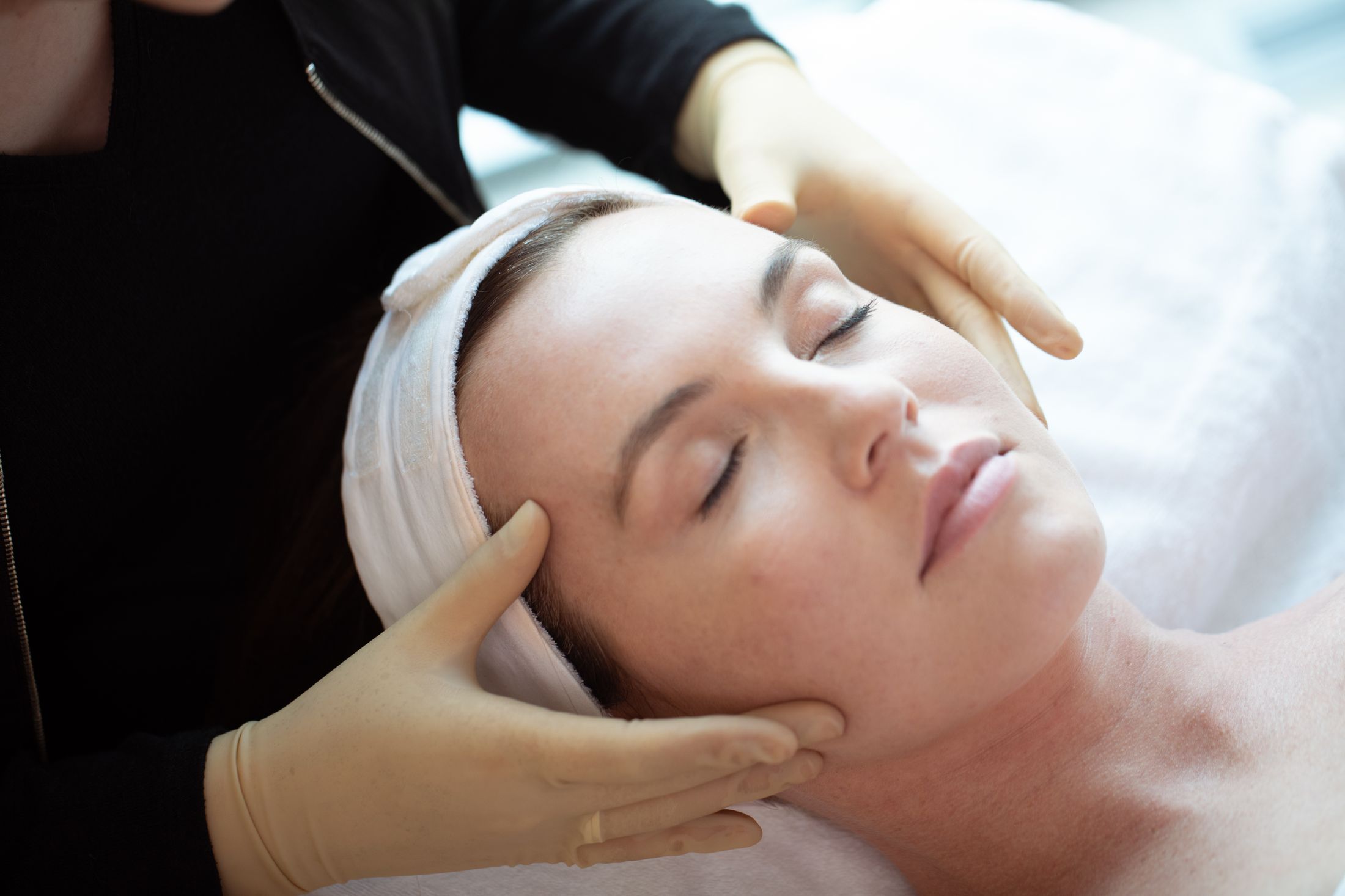 Facial massage in a serene spa setting.