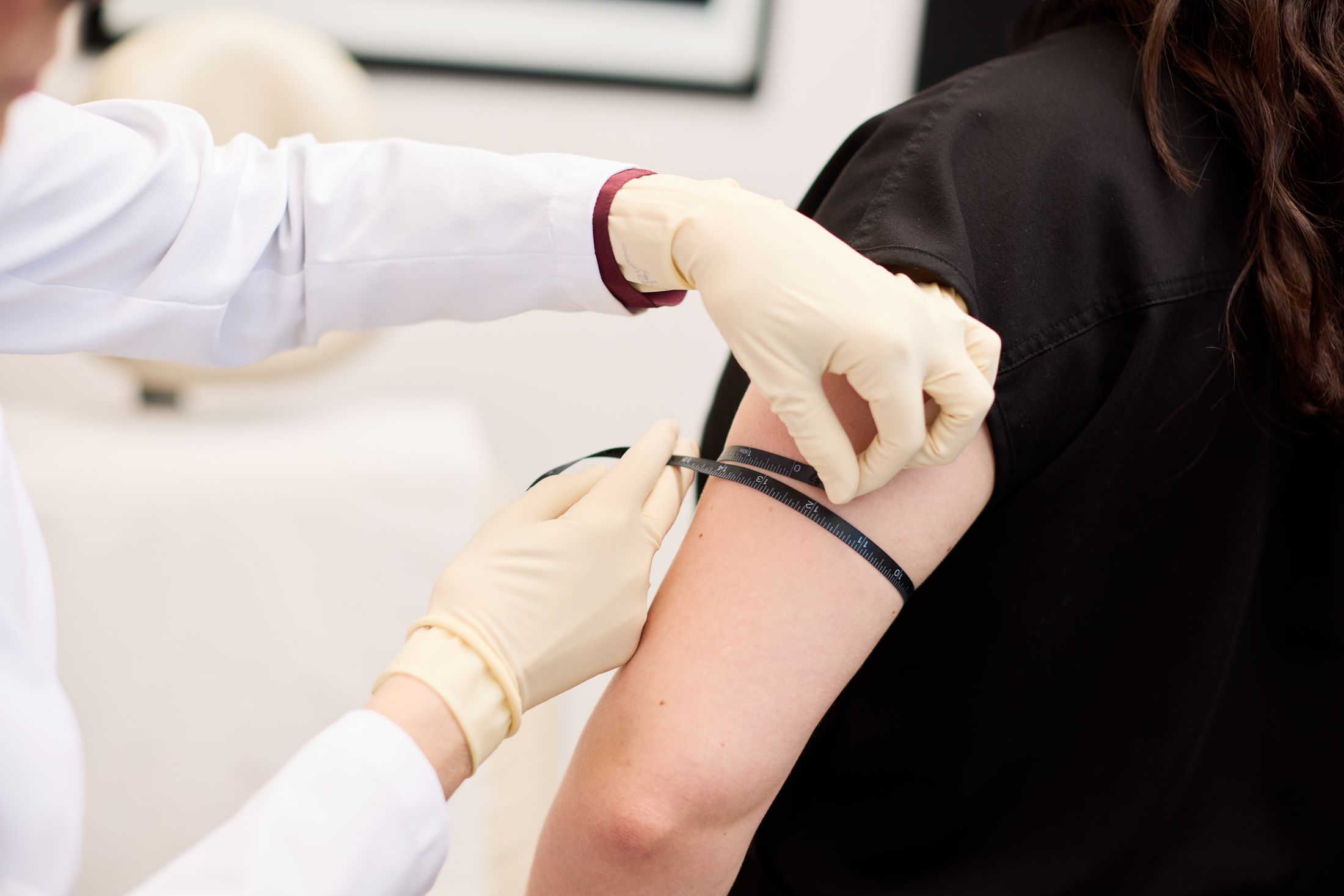 Measuring arm before vaccination procedure.