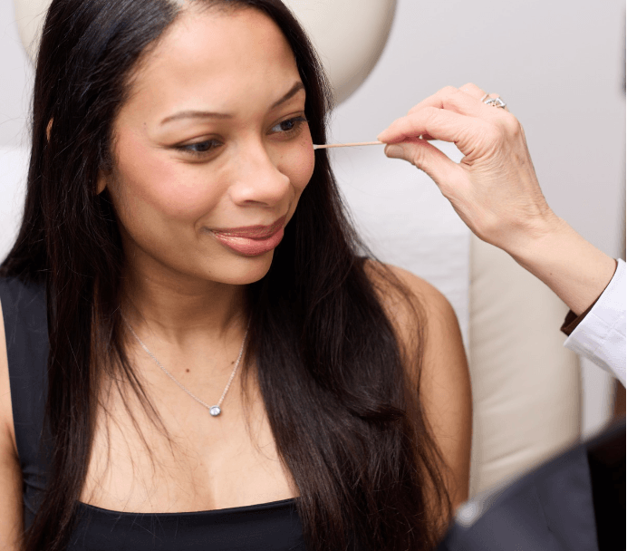 Skincare treatment session in a clinic setting.