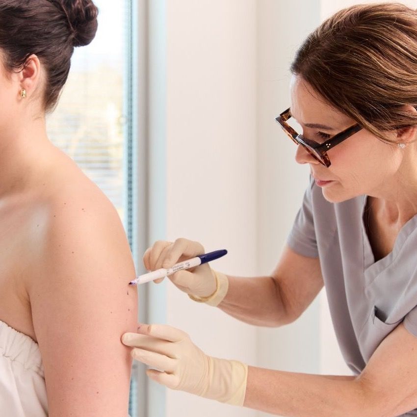 Medical professional preparing for an injection.