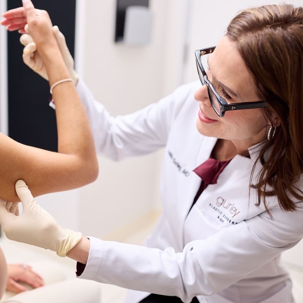 Doctor administering treatment to patient in clinic.